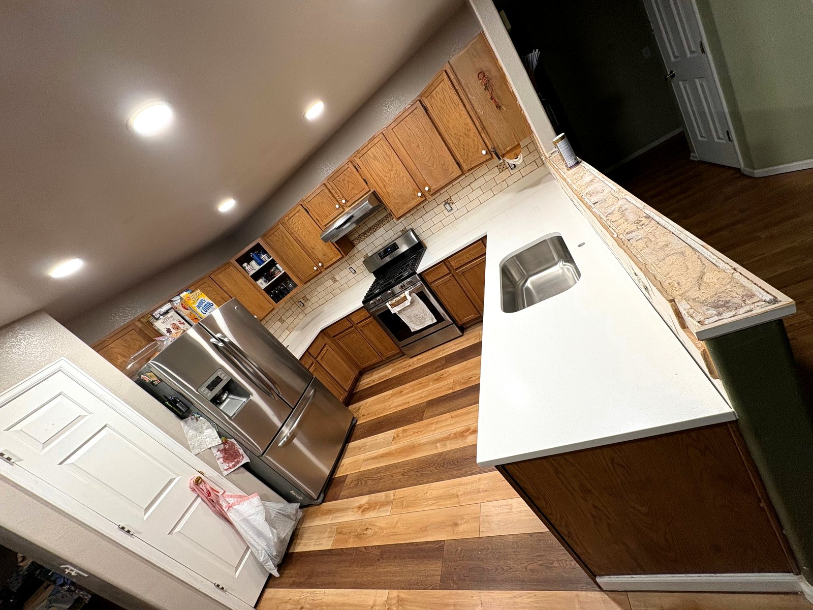 Peninsula Countertop Install — Seamless quartz peninsula with a custom sink cutout